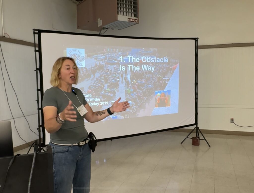 Woman presenting in front of screen