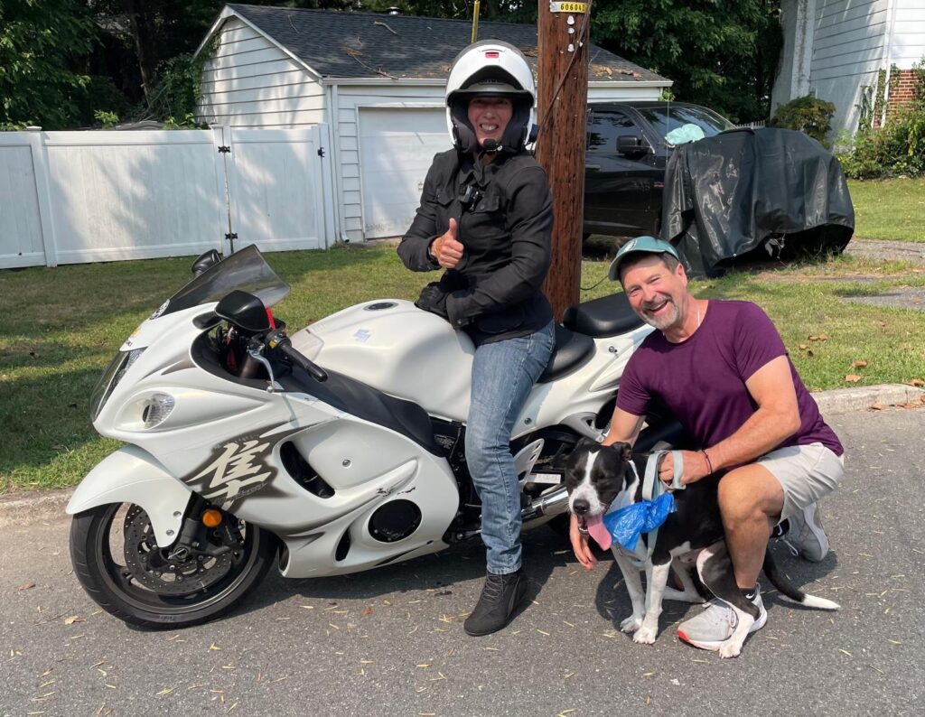 Woman on Hayabusa and man and dog